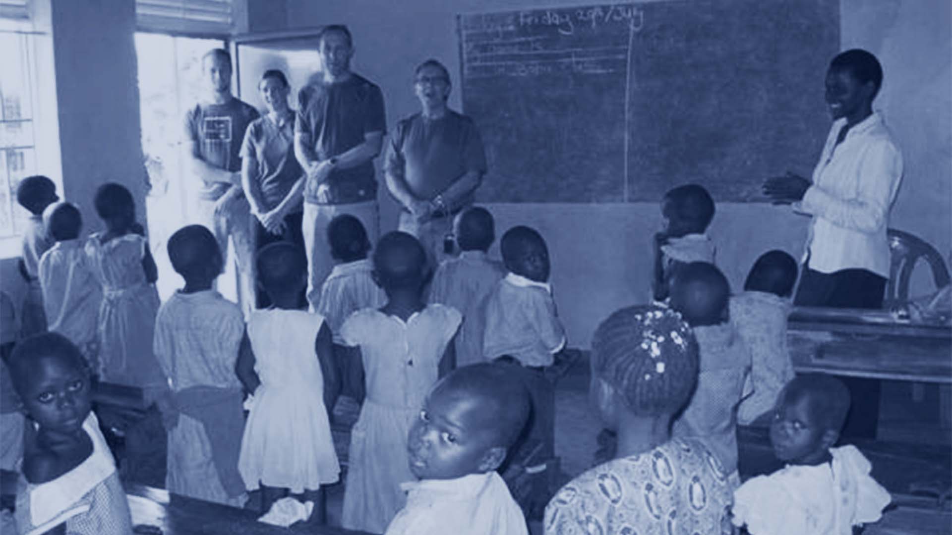 teachers and kids gathering in a classroom